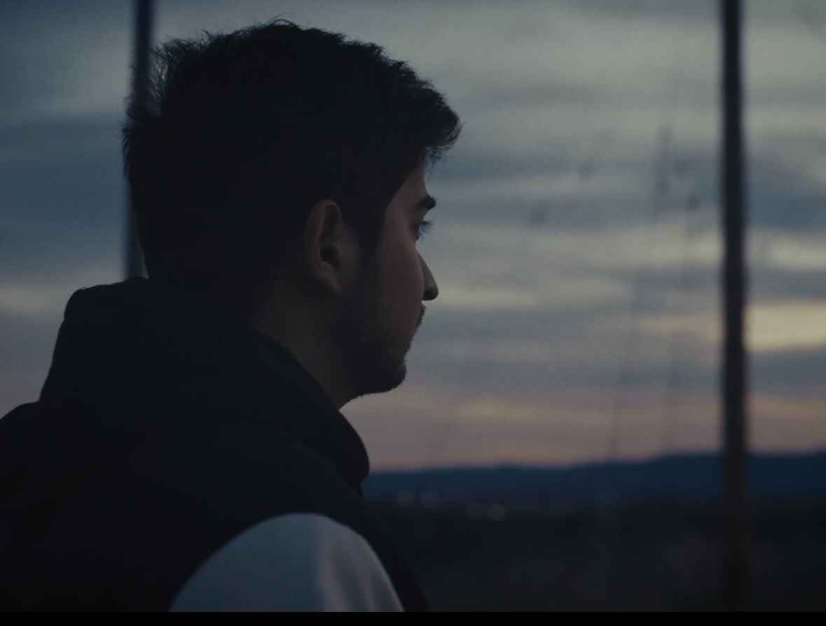 Rohan staring into a sunset