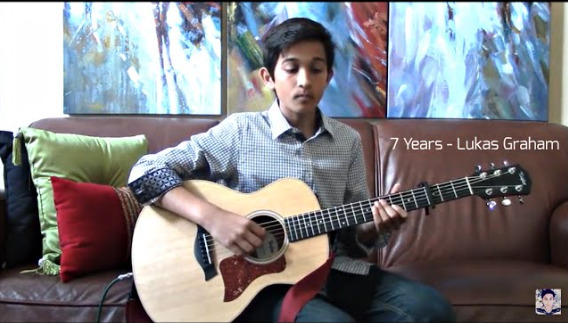Young Rohan playing guitar
